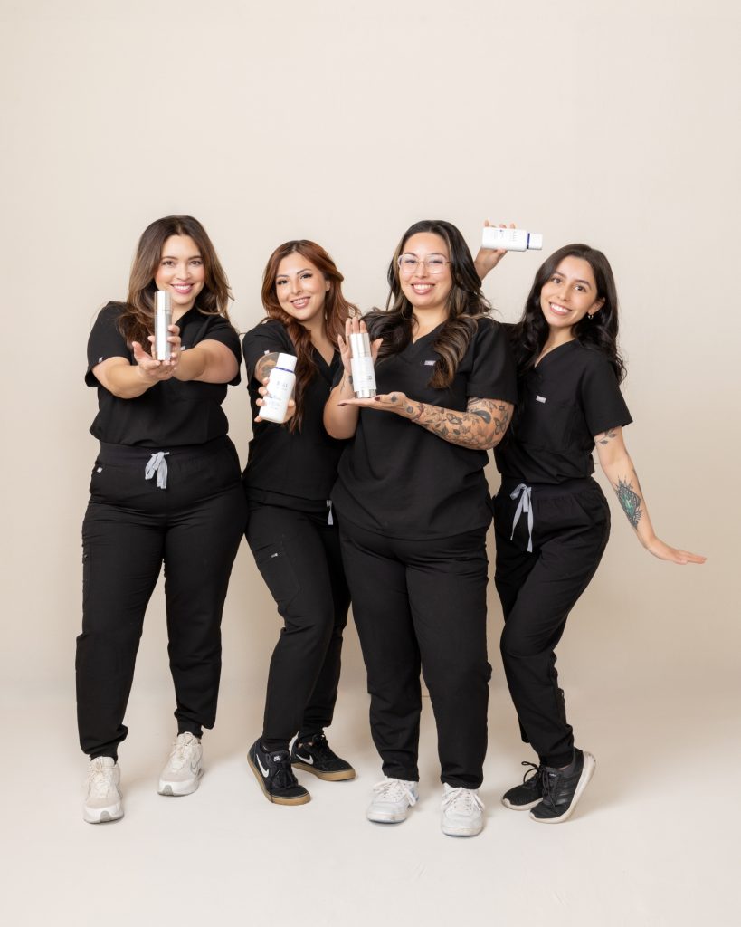 “The MedSpa team posed together in a professional studio setting, showcasing unity, expertise, and a polished brand image that reflects their commitment to excellence in aesthetic care.
