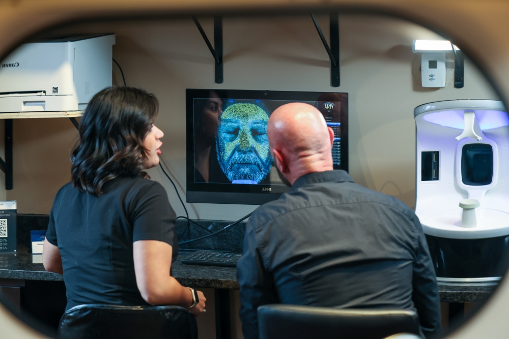 Aesthetic consultation with digital skin analysis technology, showcasing personalized MedSpa treatment planning and high-tech diagnostics.