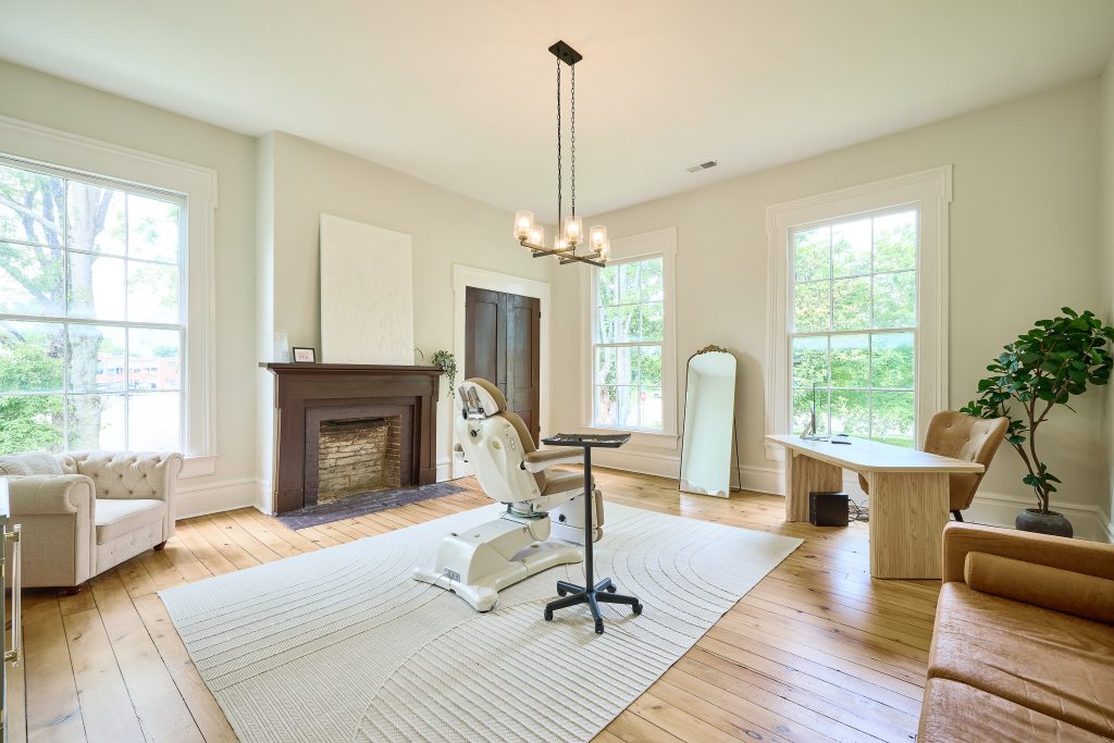 Elegant MedSpa consultation room with classic architectural features, soft natural light, and upscale MedSpa decor for a refined client experience.